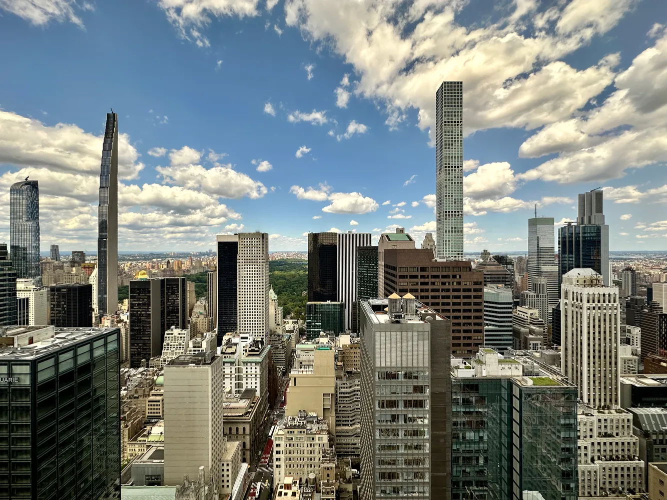 a living room with furniture a rug and a table