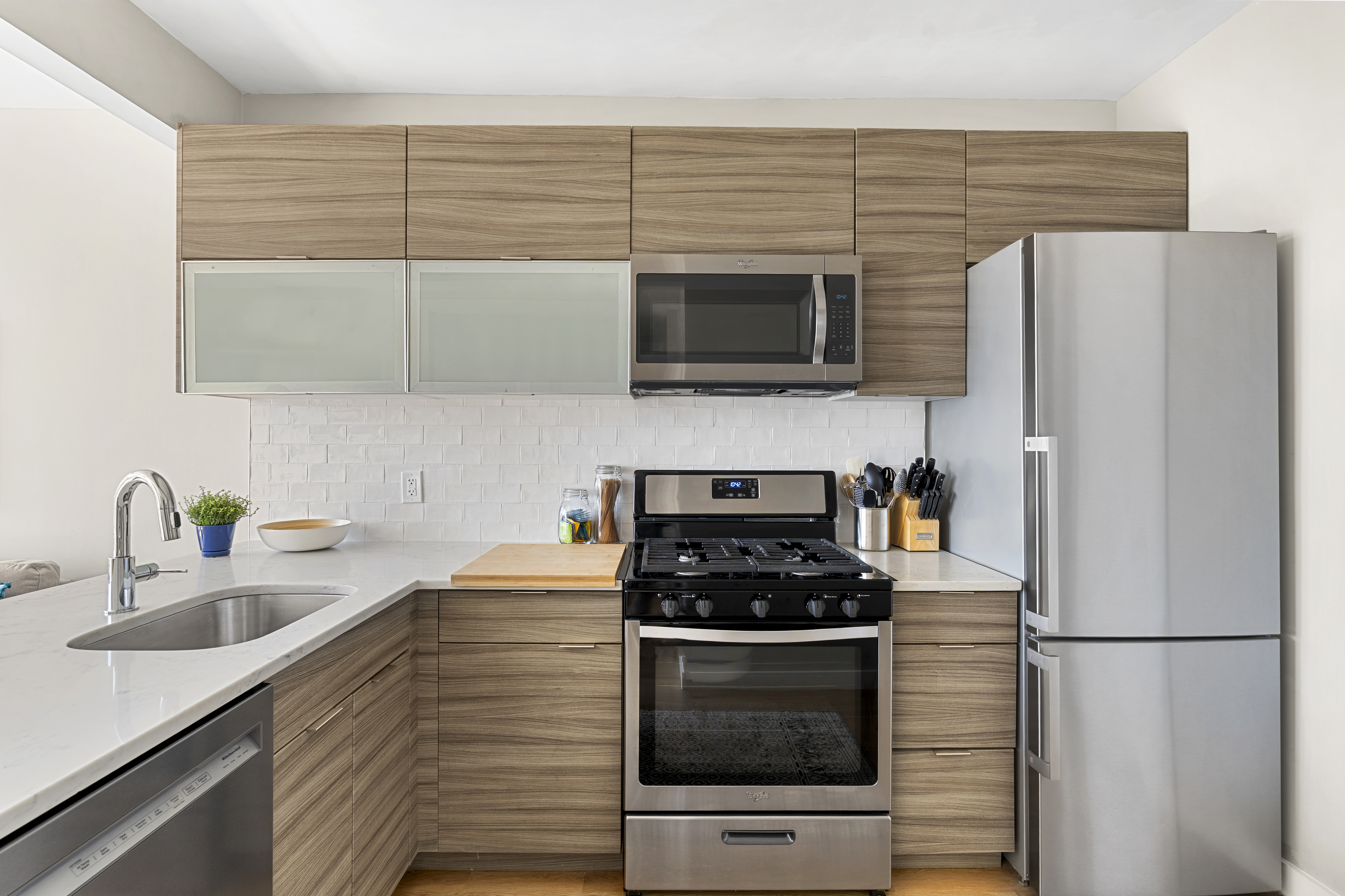 516 Classon Avenue, Unit 4A Brooklyn, NY 11238 - Photo 5 of 9 a kitchen with a refrigerator stove and microwave