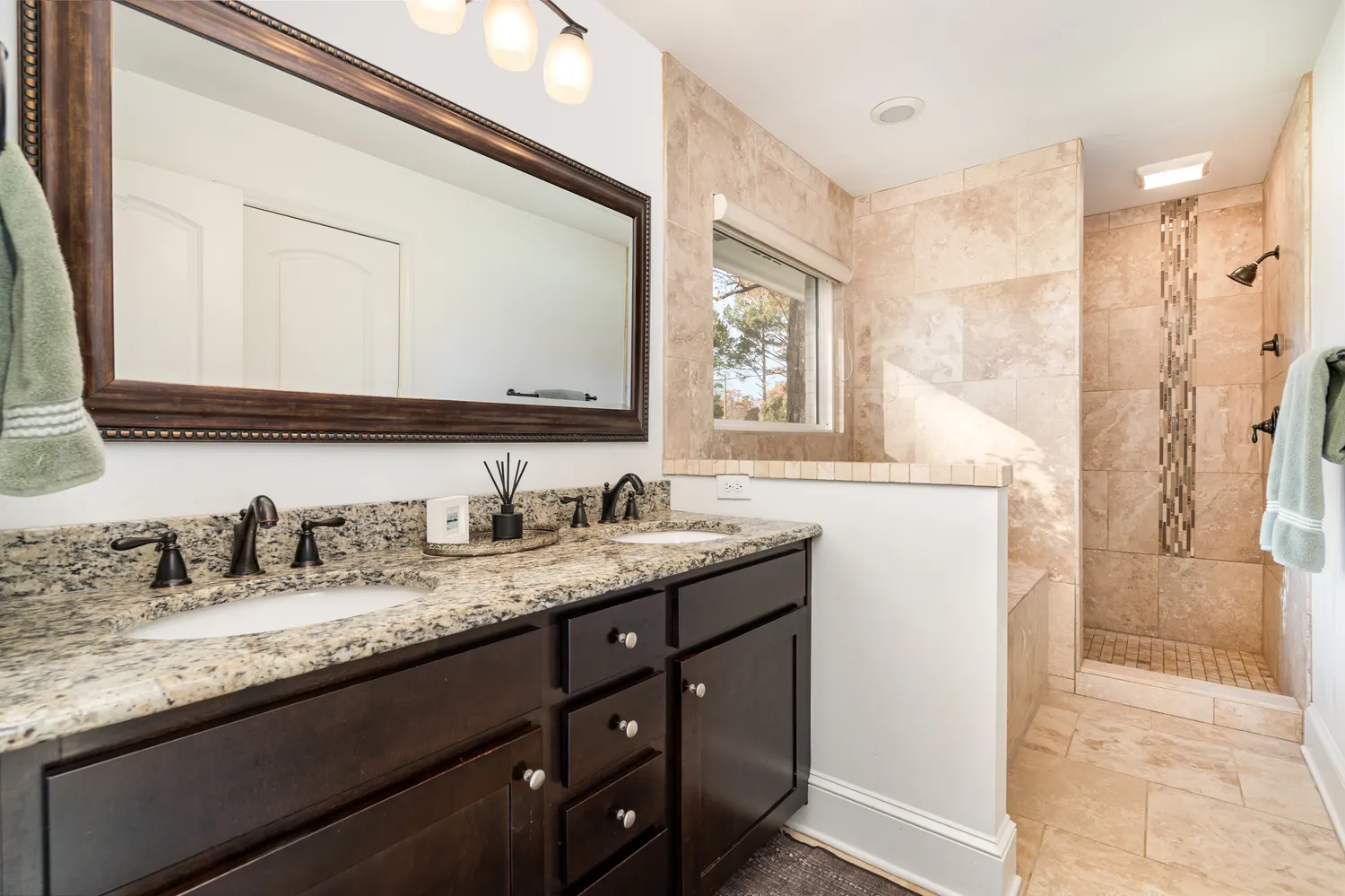 a bathroom with a granite countertop sink mirror and a