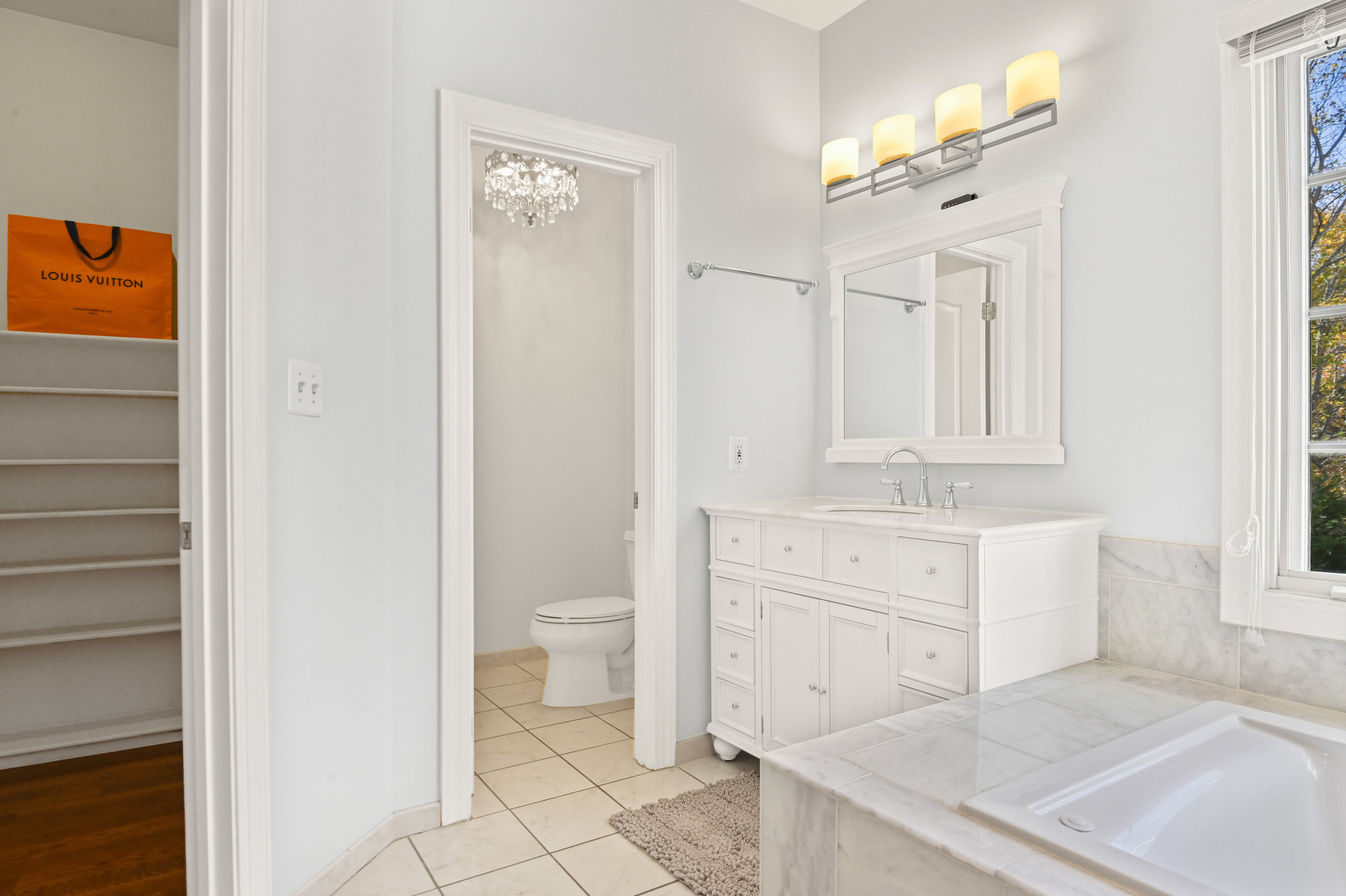 2628 Five Oaks Road Vienna, VA 22181 - Photo 25 of 40 a bathroom with a granite countertop sink mirror and a toilet
