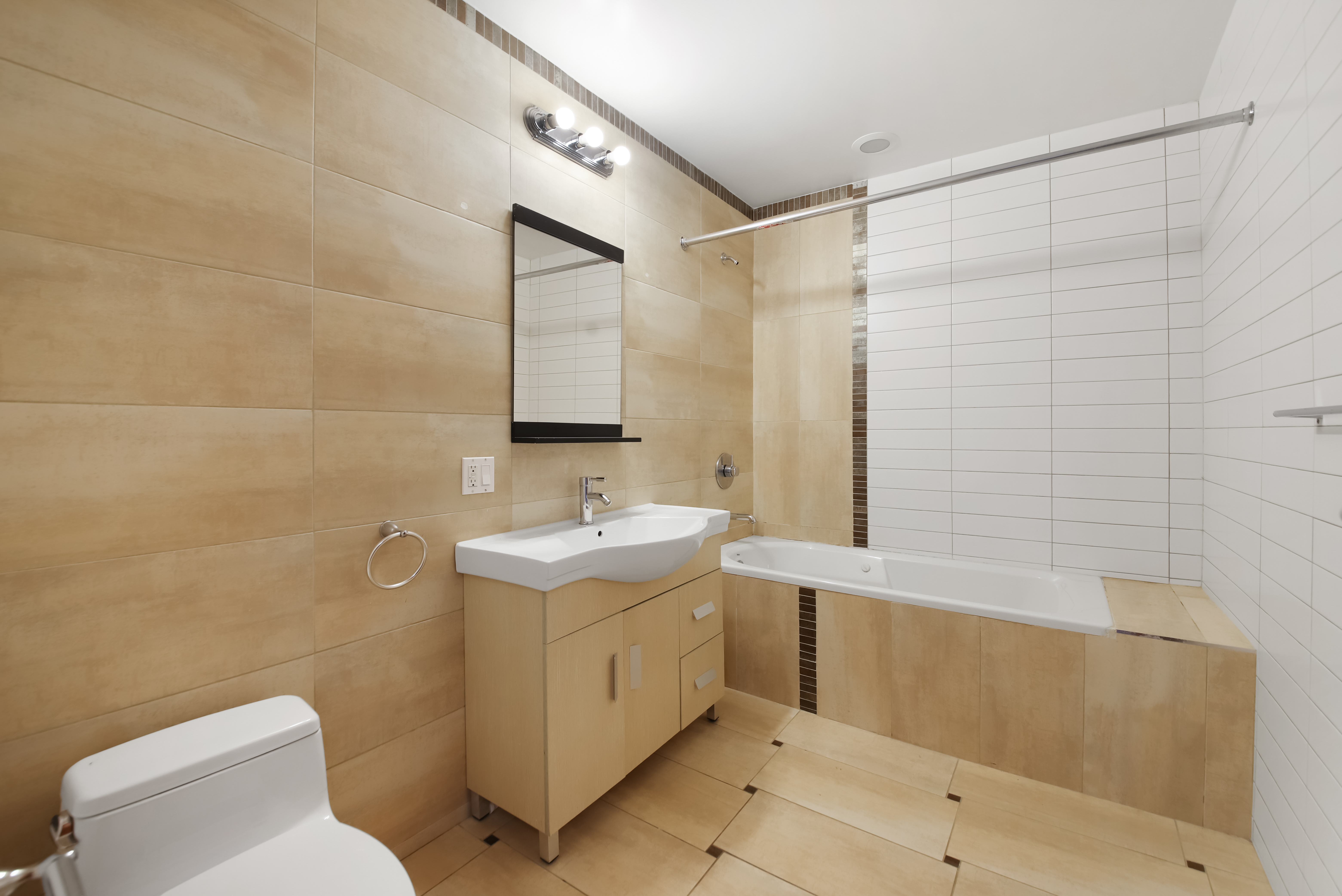 3112 Emmons Avenue, Unit 206 Brooklyn, NY 11235 - Photo 7 of 10 a bathroom with a sink toilet and shower