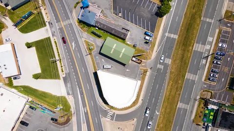 an aerial view of a house with a swimming pool