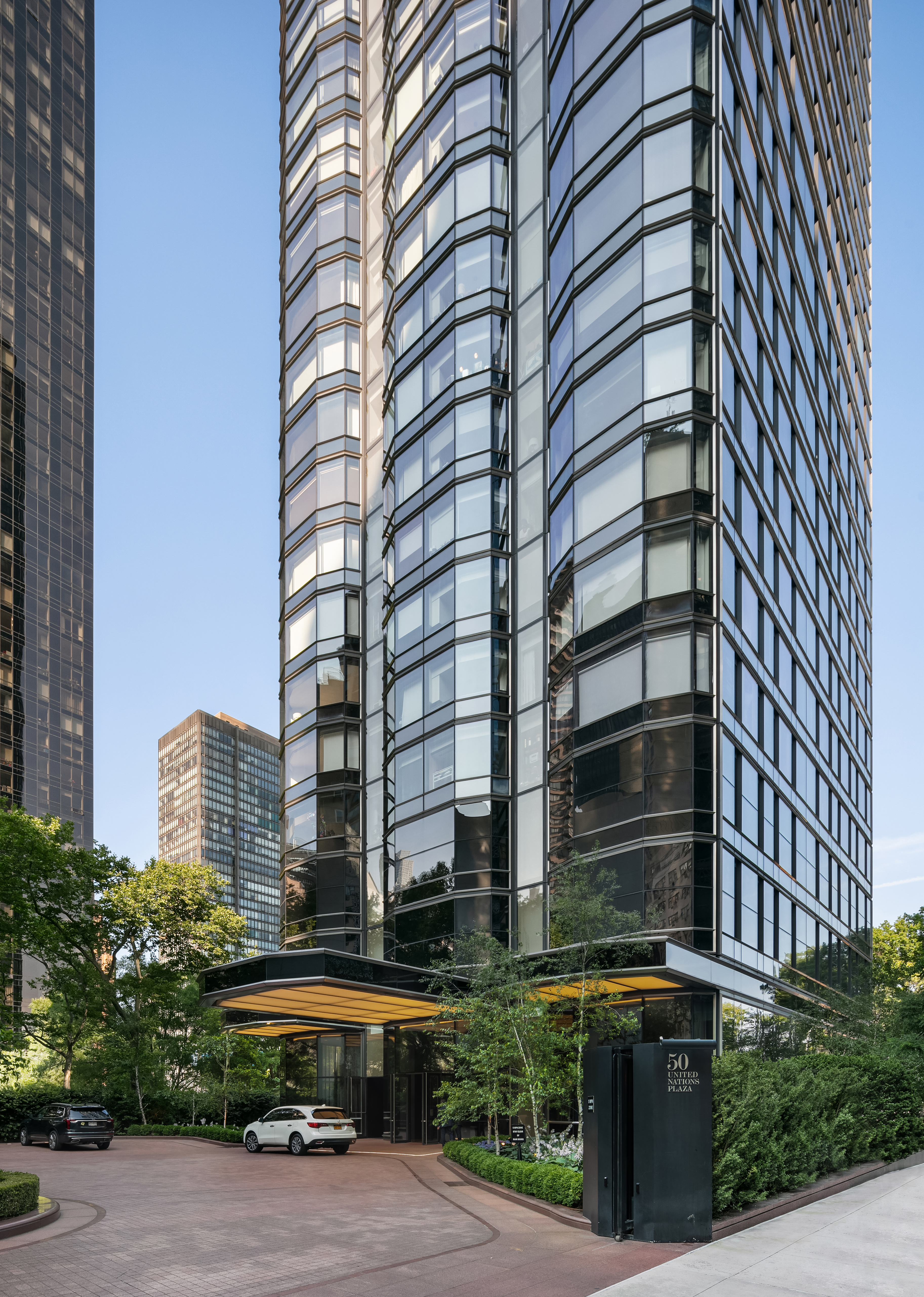 50 United Nations Plaza, Unit 6C Manhattan, NY 10017 - Photo 14 of 15 a front view of a building with street view