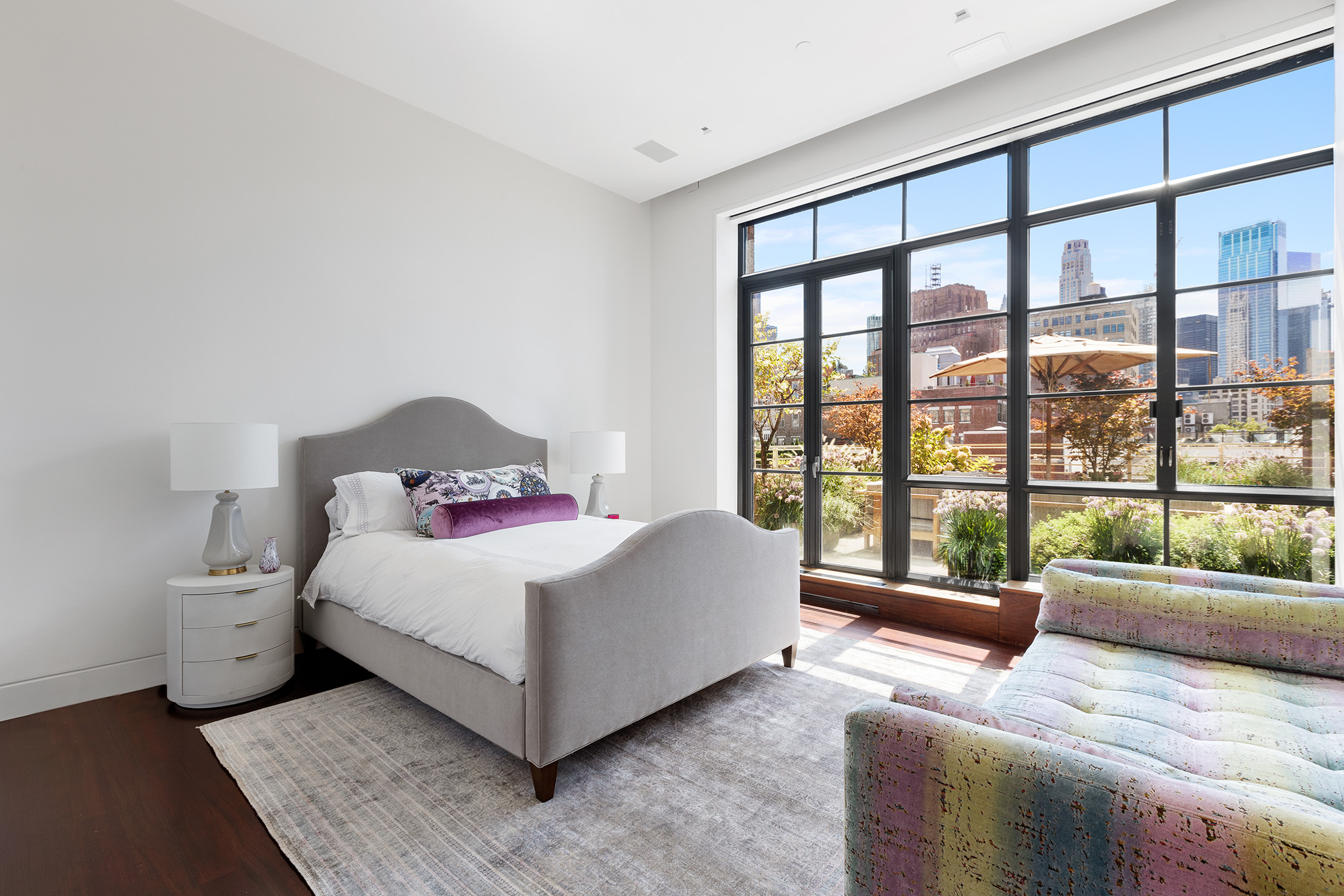 7 Hubert Street, Unit 8A Manhattan, NY 10013 - Photo 14 of 19 a living room with a large bed and a large window