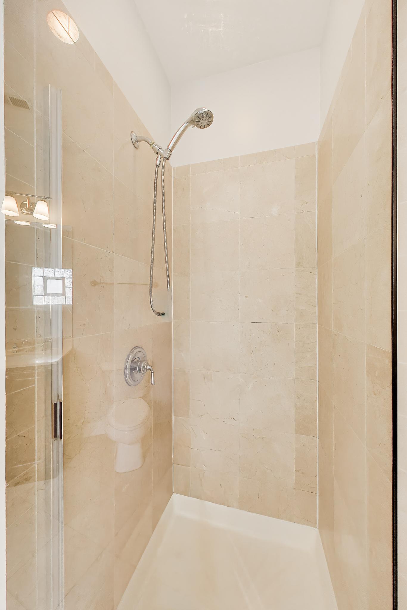 4845 North Springfield Avenue, Unit 2 Chicago, IL 60625 - Photo 27 of 32 a bathroom with a shower
