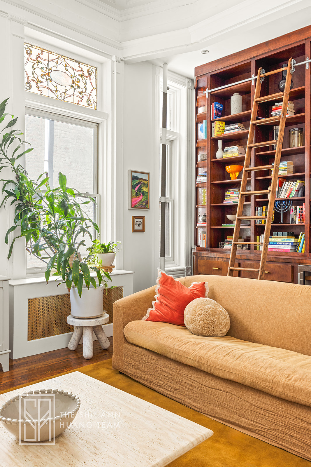 10 8th Avenue, Unit 2 Brooklyn, NY 11217 - Photo 4 of 18 a living room with furniture and a potted plant