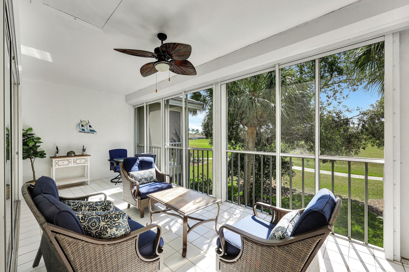 8228 Twelve Oaks Circle, Unit 323 Naples, FL 34113 - Photo 21 of 26 a outdoor living space with furniture and garden view