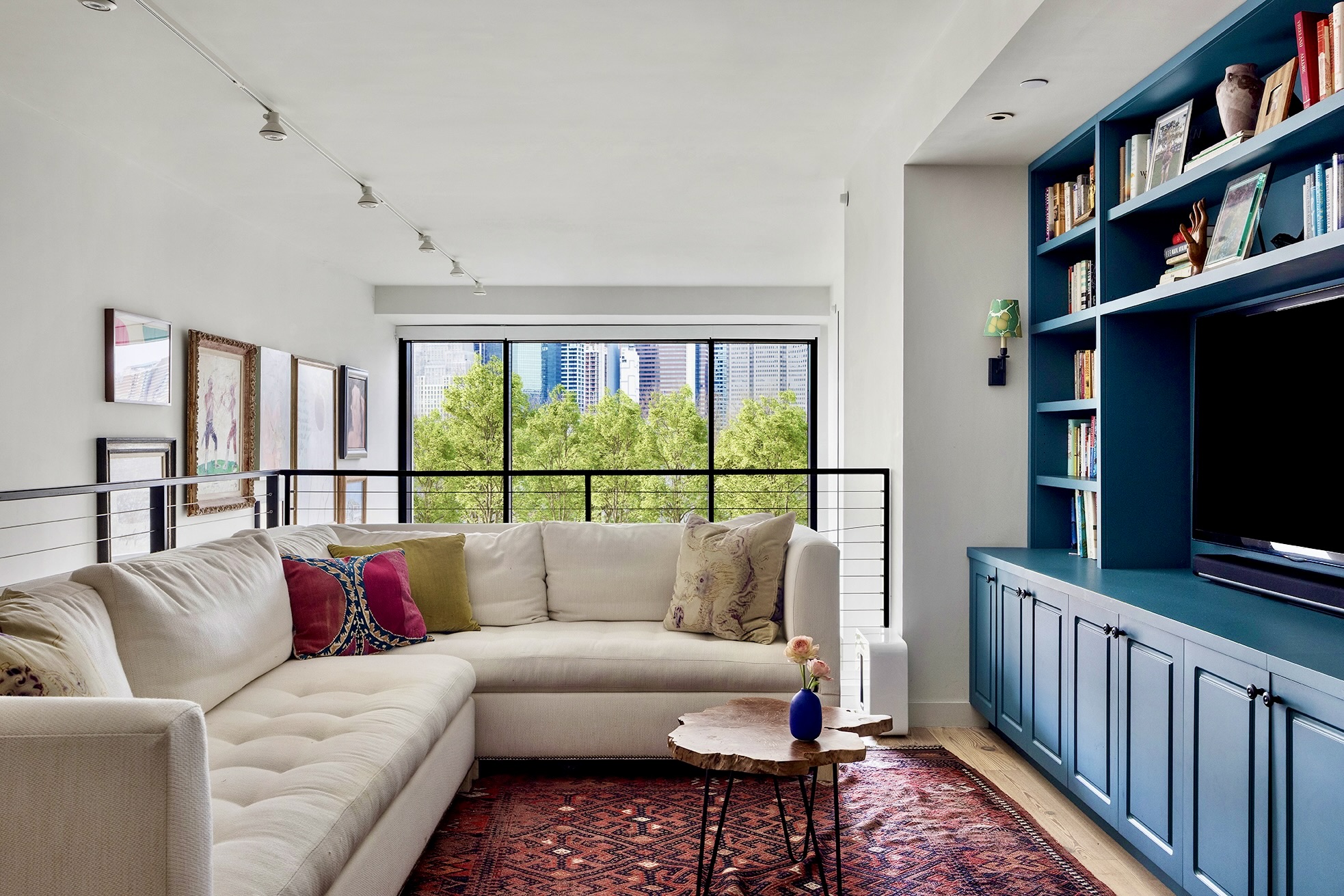 90 Furman Street, Unit N510 Brooklyn, NY 11201 - Photo 8 of 31 a living room with furniture a window and a flat screen tv
