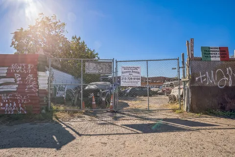 a view of a street with a building in the background