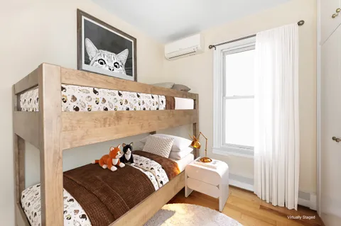 a bed room with a bed and a window