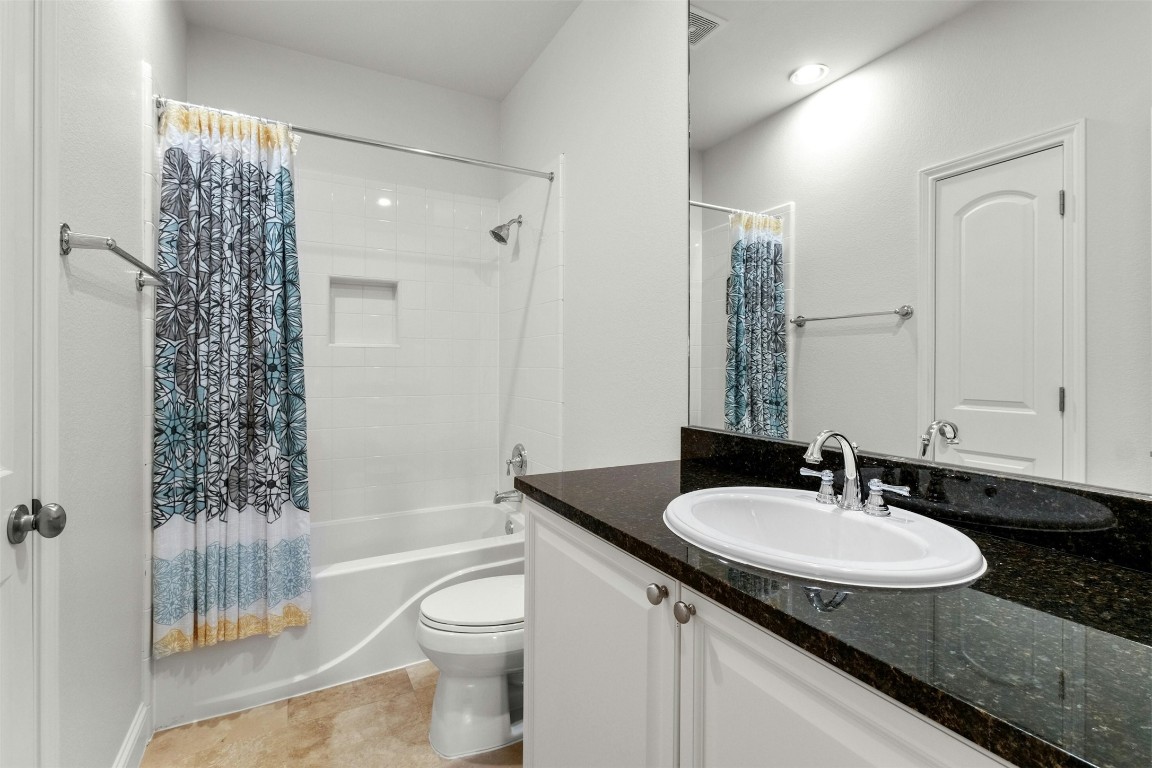 2505 Enfield Road, Unit 4 Austin, TX 78703 - Photo 16 of 19 a bathroom with a granite countertop sink toilet and shower