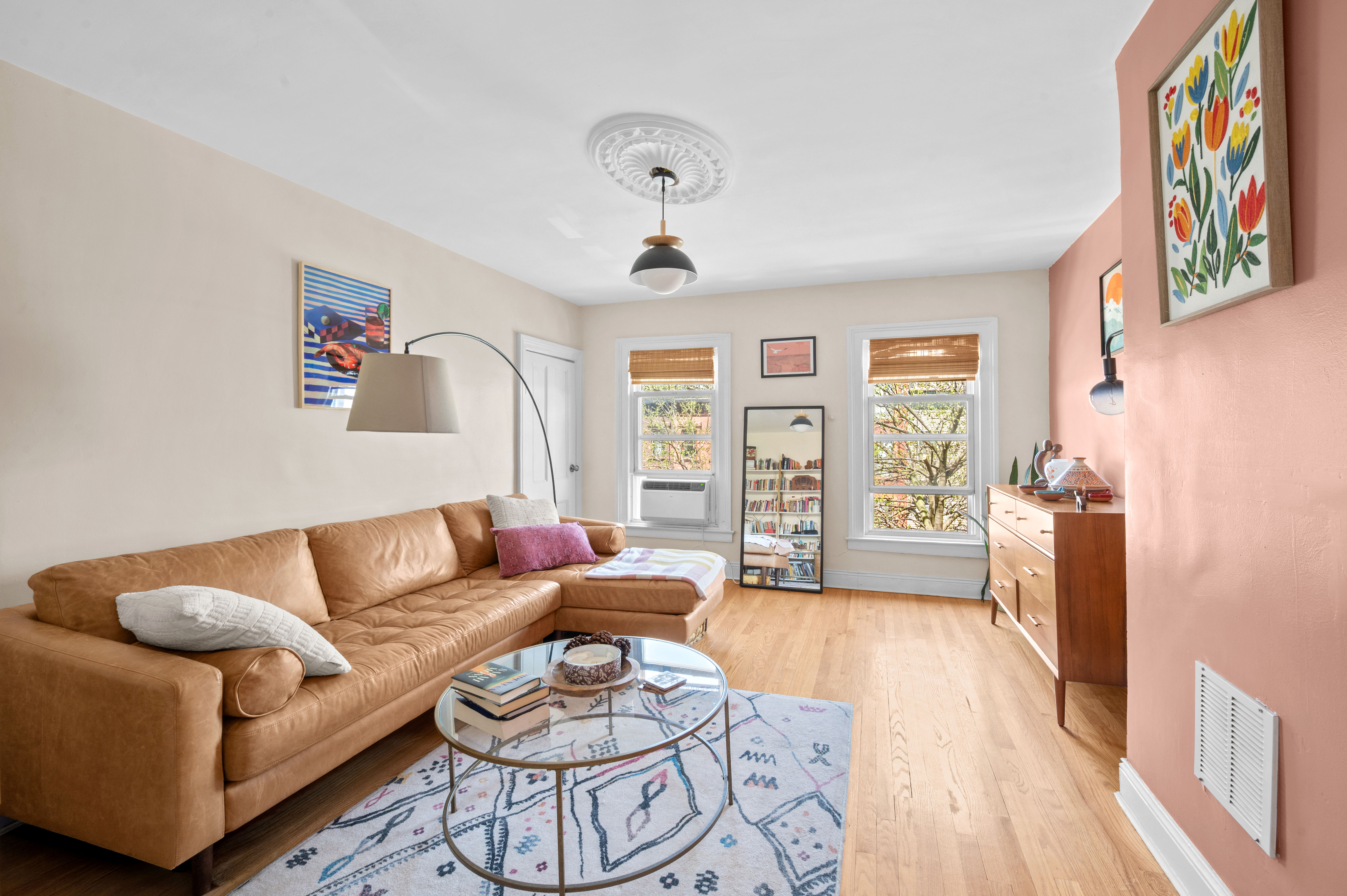 a living room with furniture and a large window