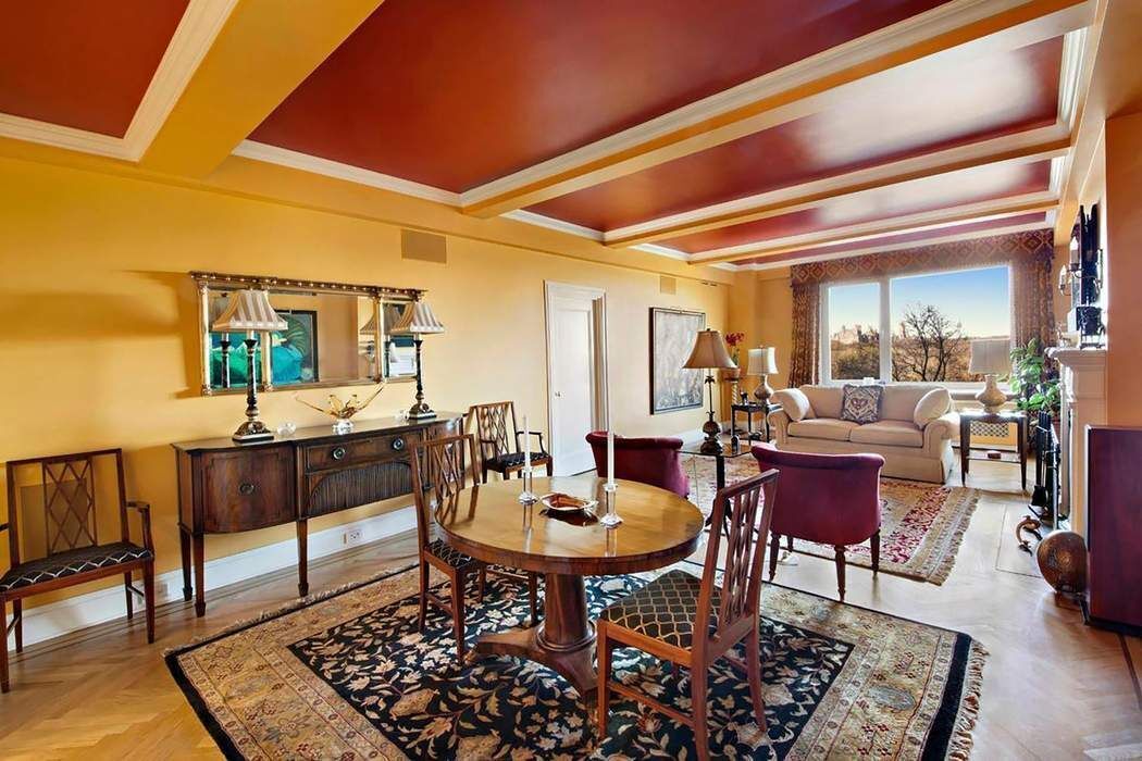 128 Central Park South, Unit 9B Manhattan, NY 10019 - Photo 2 of 11 a living room with furniture and a wooden floor