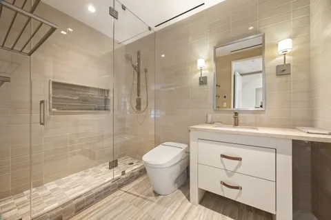 a living room with furniture and a book shelf