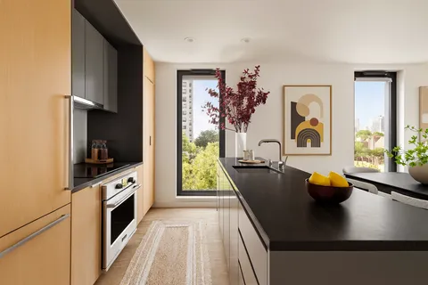 a view of living room with furniture and flat screen tv