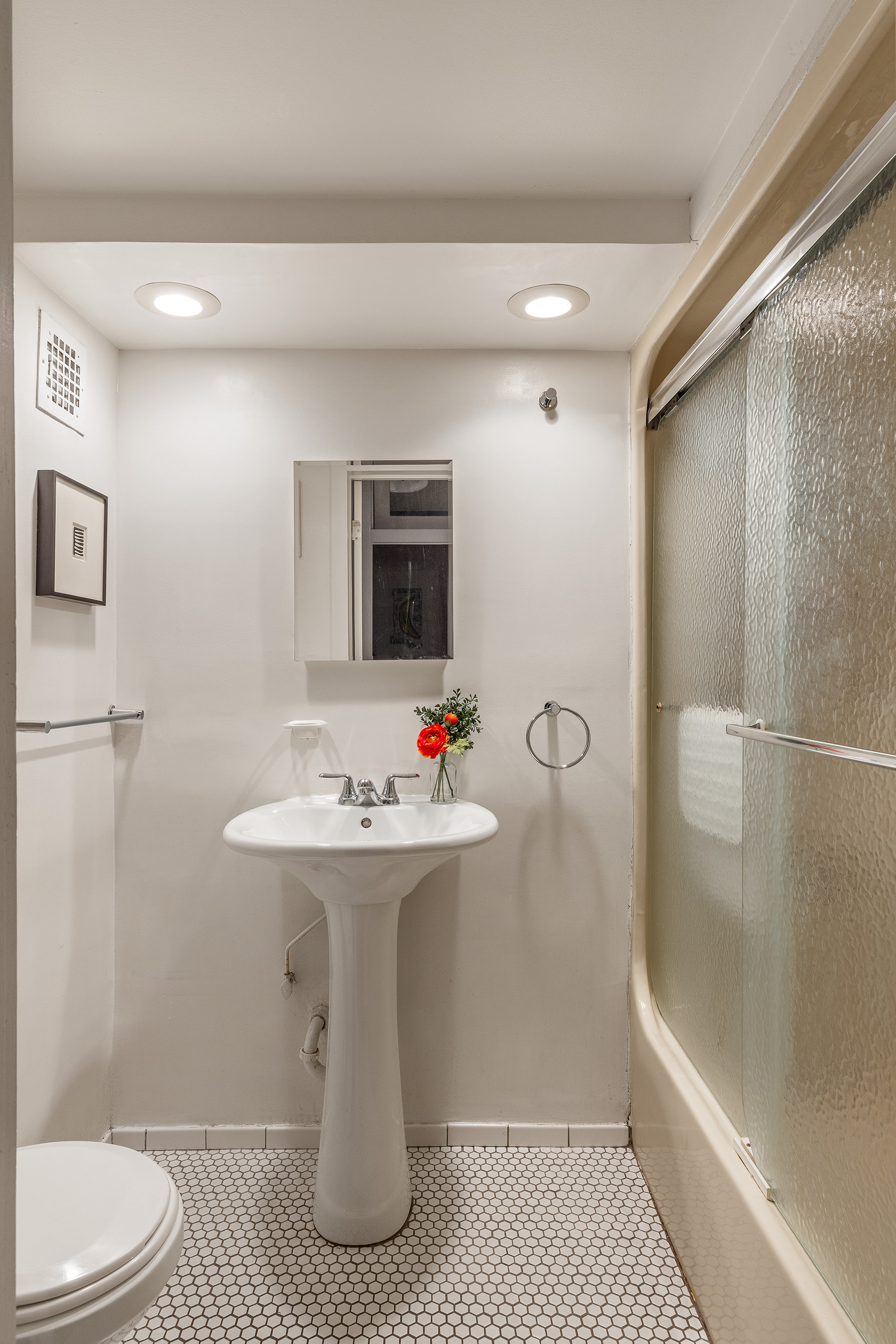 120 Boerum Place, Unit 2E Brooklyn, NY 11201 - Photo 9 of 13 a bathroom with a sink toilet and shower