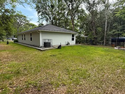 a house that has a tree in front of it