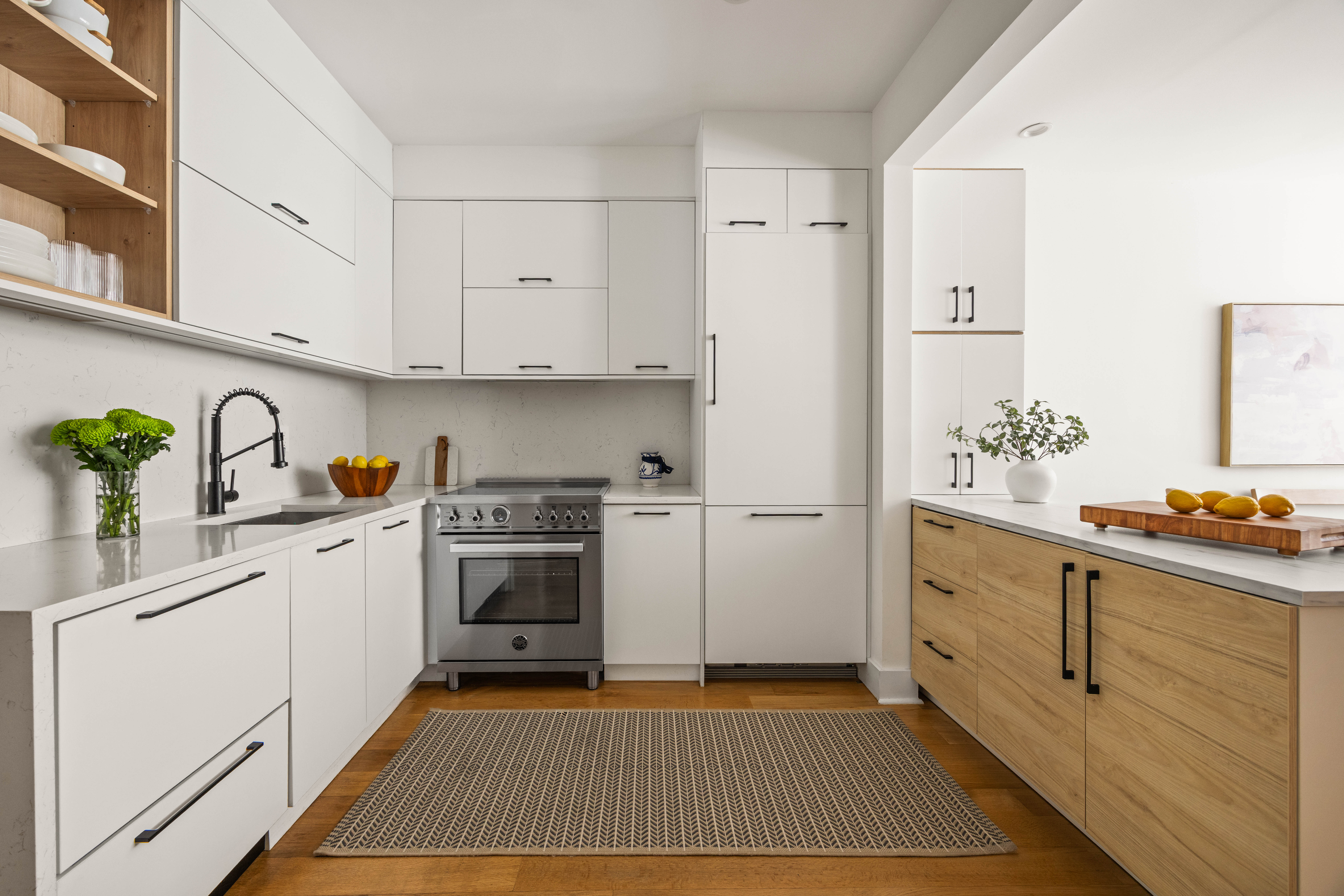 473 Bainbridge Street, Unit 1 Brooklyn, NY 11233 - Photo 2 of 15 a kitchen with white cabinets and white appliances