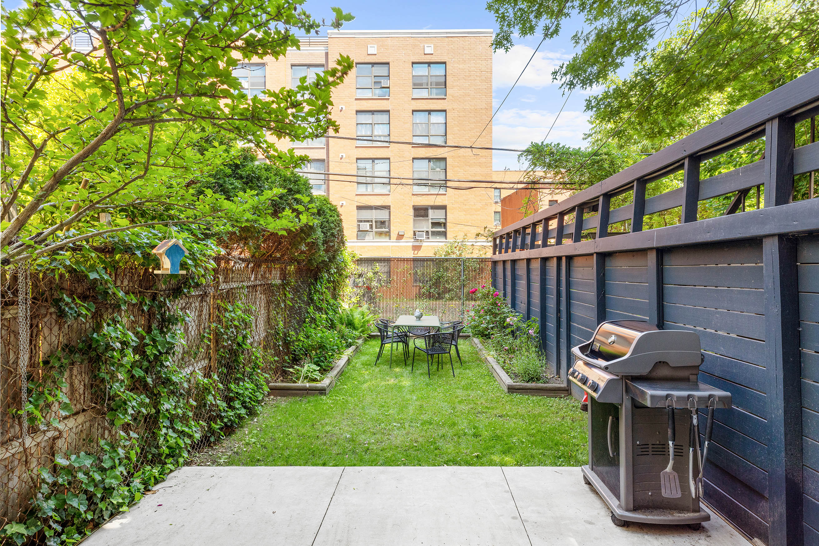 379 Monroe Street Brooklyn, NY 11221 - Photo 13 of 15 a view of a chair and table in backyard of the house