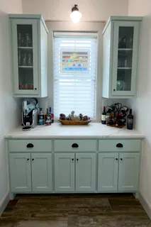 a bathroom with a sink and a window