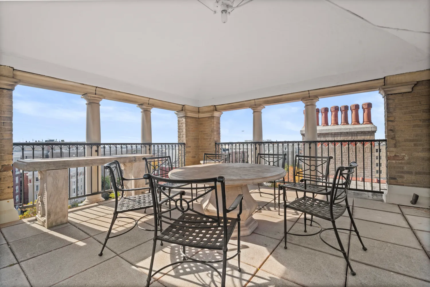 a view of a dining room with furniture and a floor to ceiling window