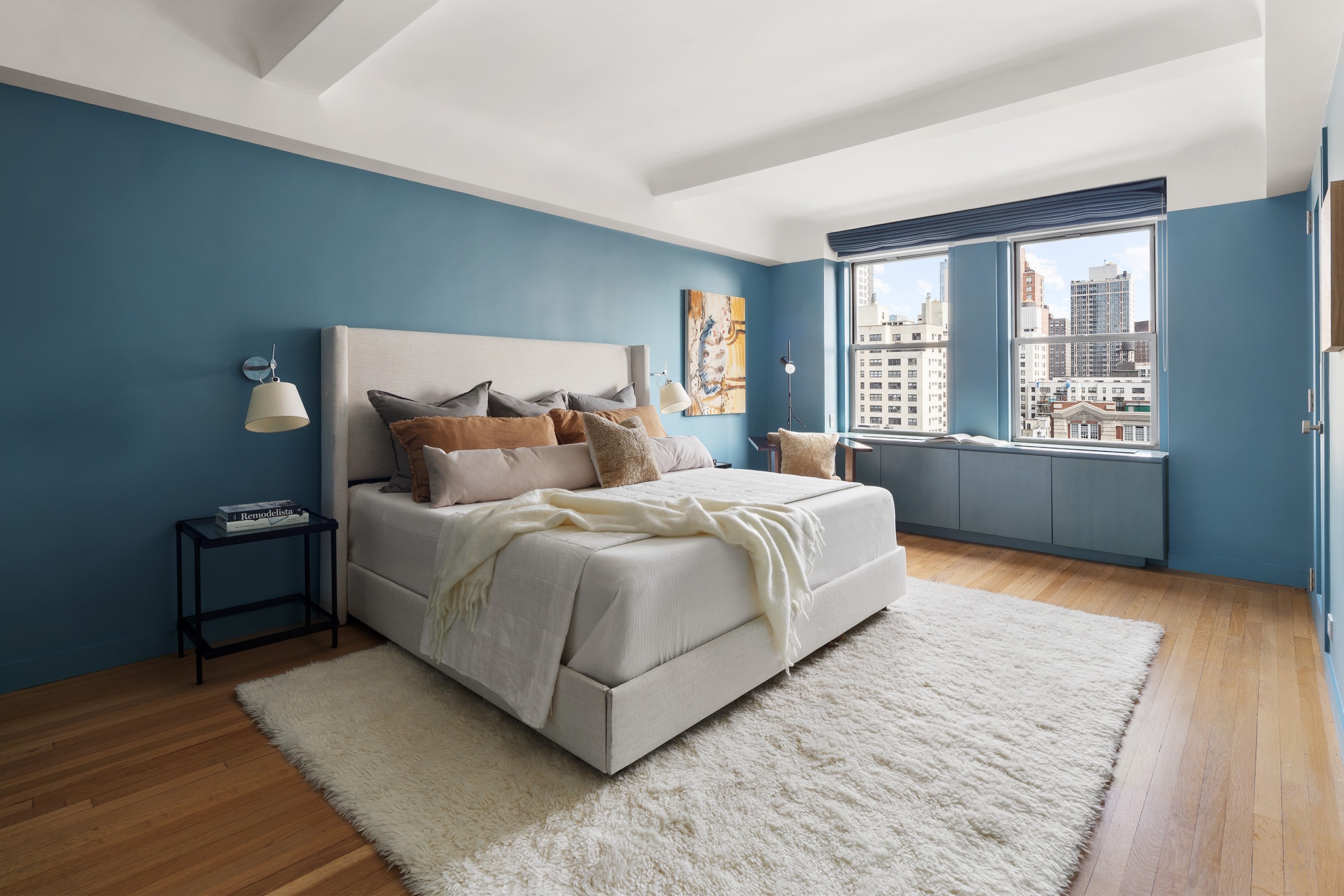 425 East 86th Street, Unit 11E Manhattan, NY 10028 - Photo 4 of 19 a spacious bedroom with a bed and wooden floor