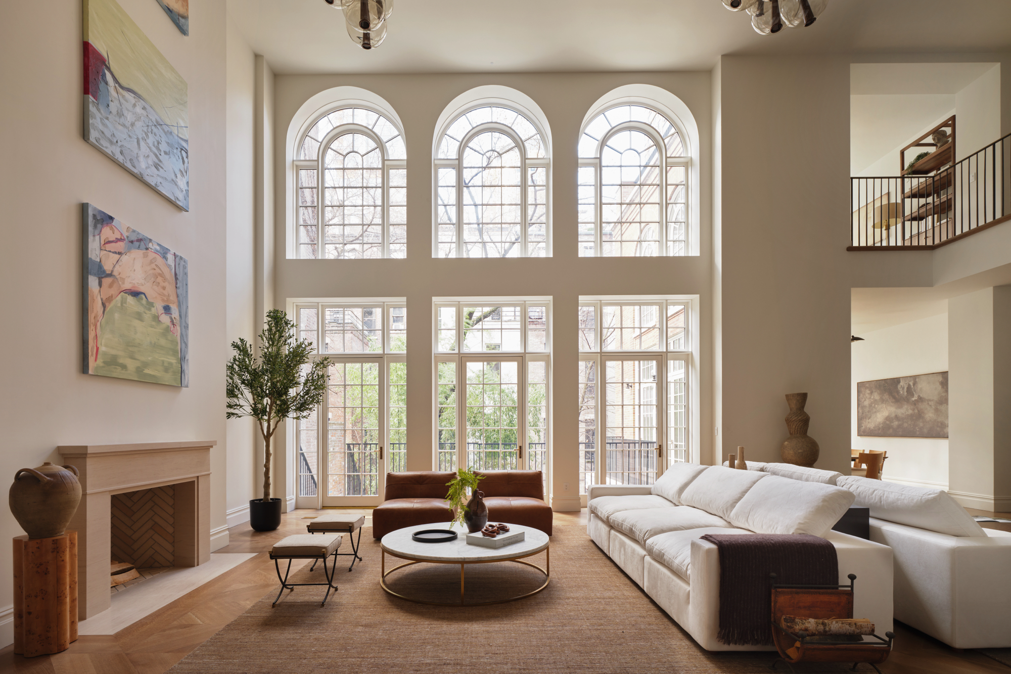 48-50 West 69th Street Manhattan, NY 10023 - Photo 1 of 1 a living room with furniture and a large window