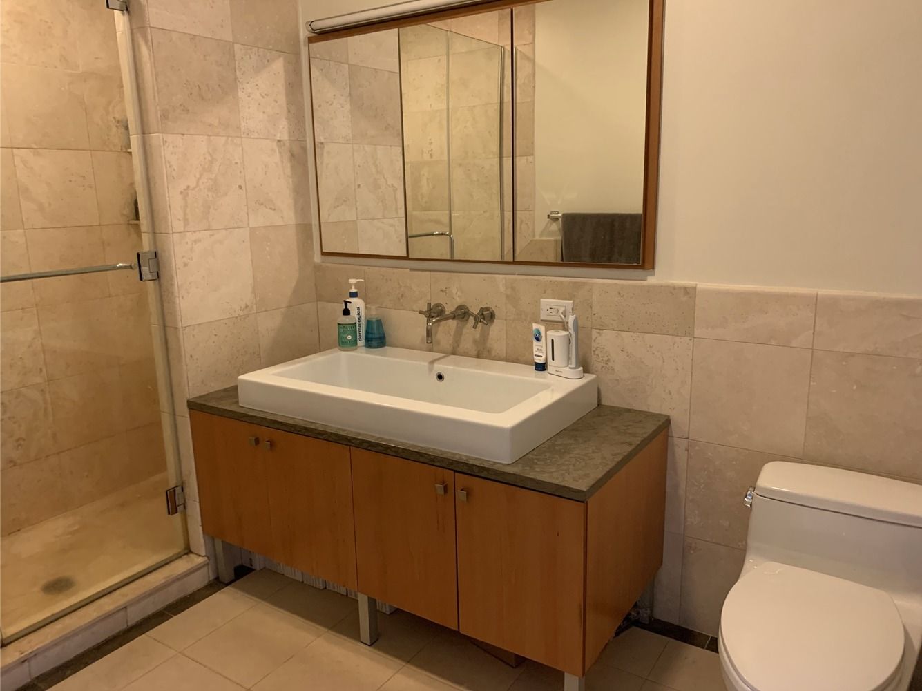 20 Broadway, Unit 501 Brooklyn, NY 11249 - Photo 7 of 8 a bathroom with a sink and a toilet