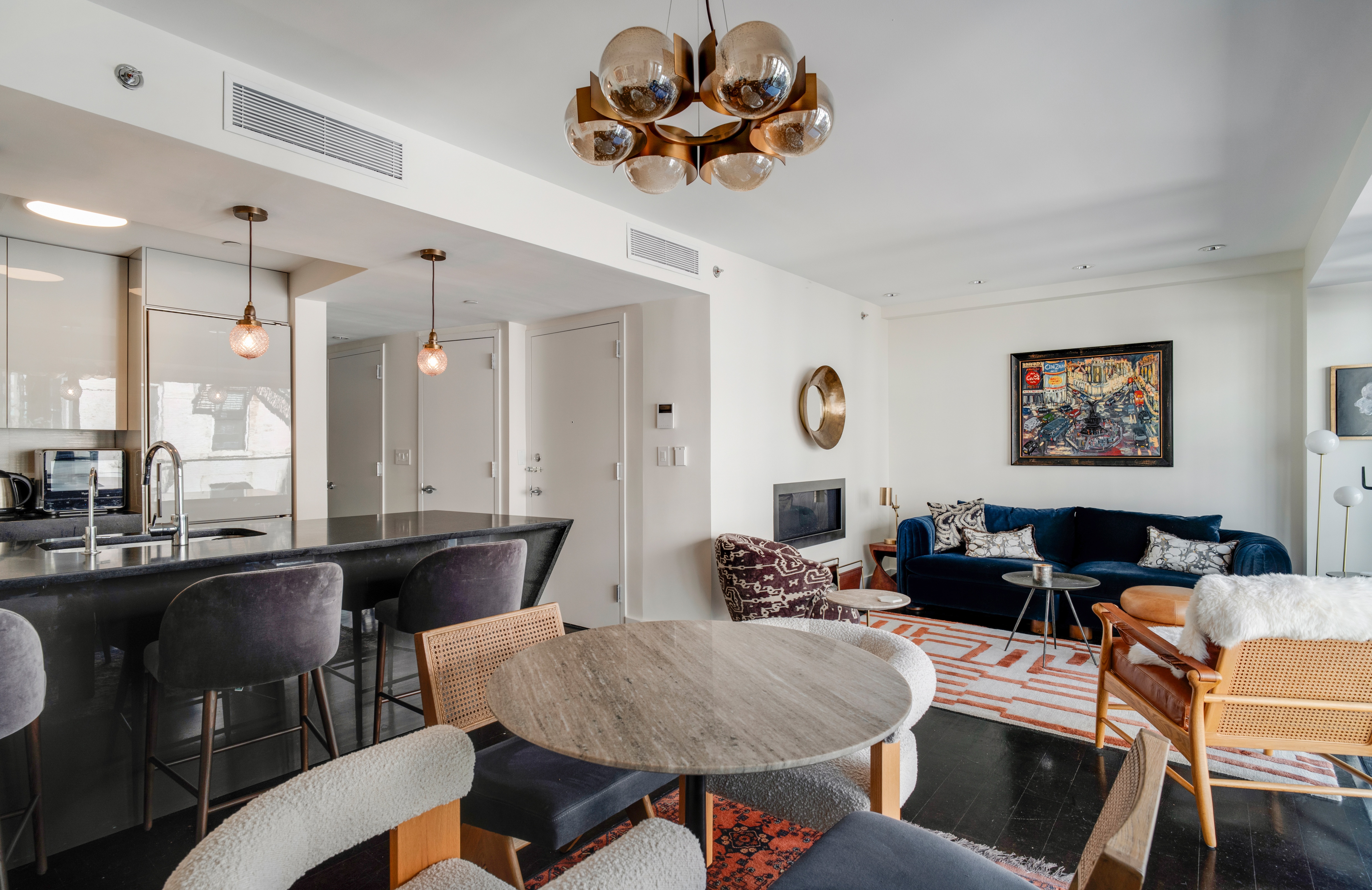 60 Orchard Street, Unit 4 Manhattan, NY 10002 - Photo 7 of 18 a living room with furniture kitchen view and a chandelier