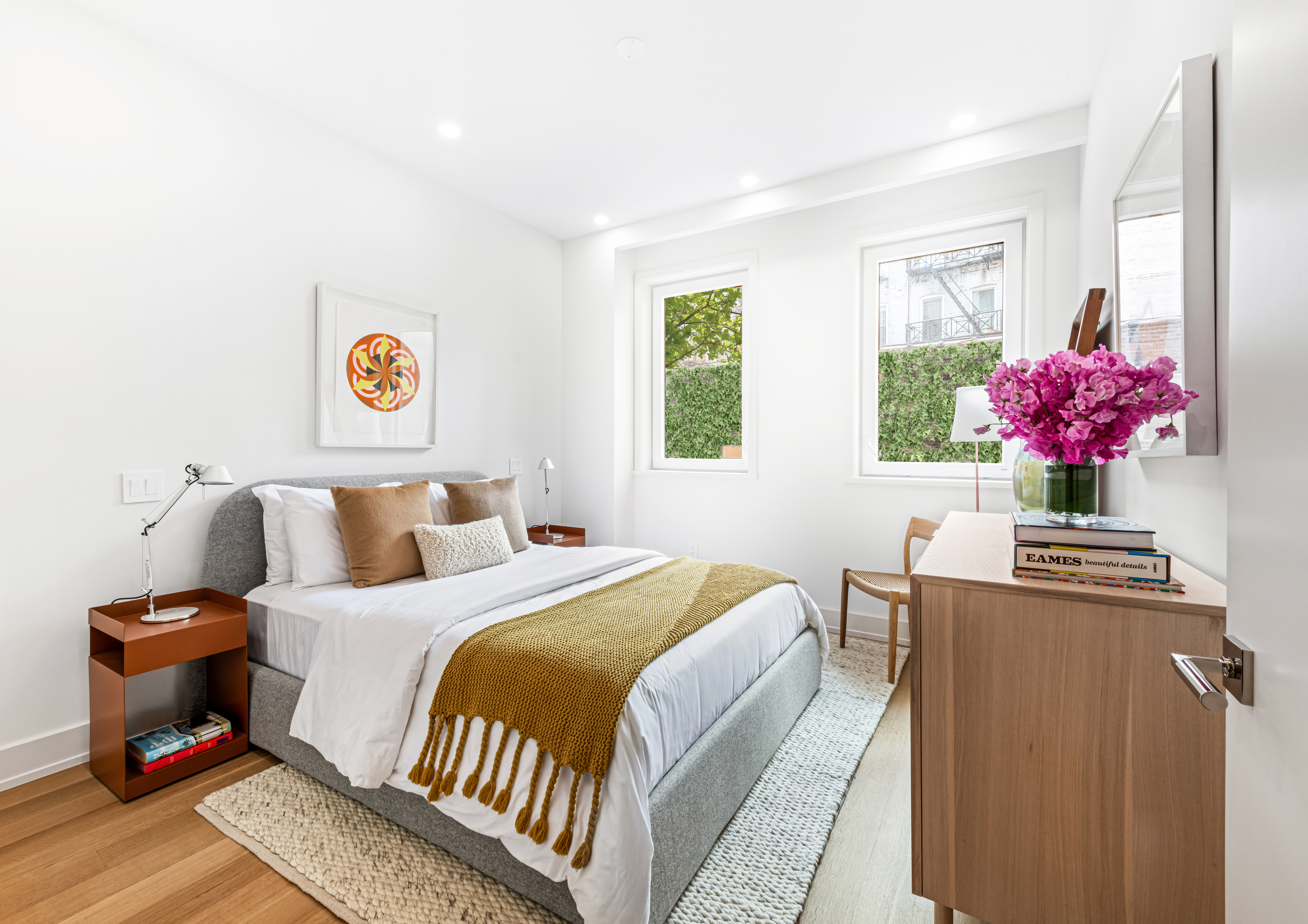 420 East 75th Street, Unit PH Manhattan, NY 10021 - Photo 8 of 24 a bedroom with a bed and a chandelier