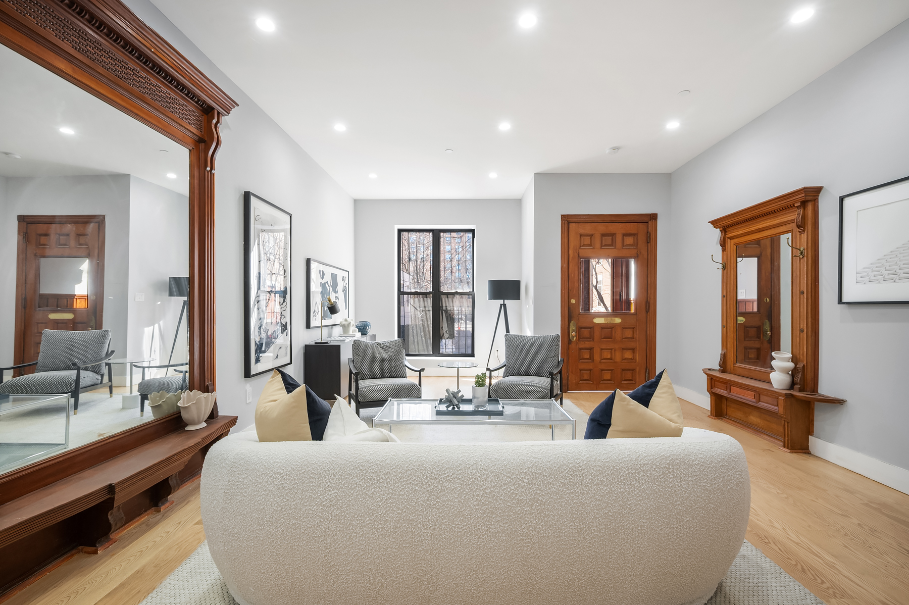 307 West 136th Street Manhattan, NY 10030 - Photo 2 of 26 a living room with furniture and large windows