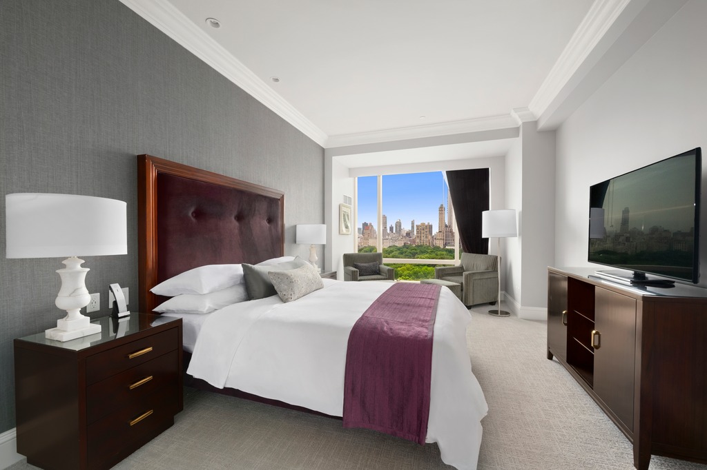 1 Central Park West, Unit 1506 Manhattan, NY 10023 - Photo 6 of 16 a bedroom with a bed and a flat screen tv