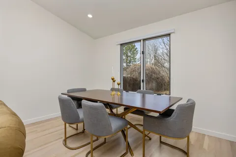 a view of a dining room with furniture window and outside view