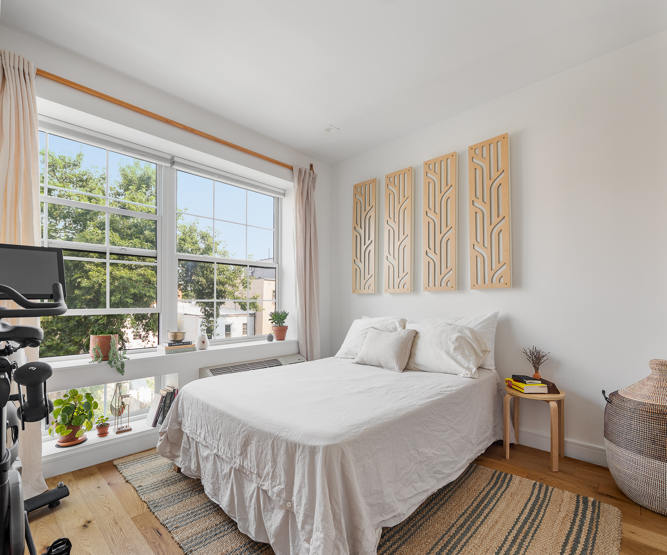 1229 Putnam Avenue, Unit 3B Brooklyn, NY 11221 - Photo 4 of 7 a bedroom with a bed and wooden floor