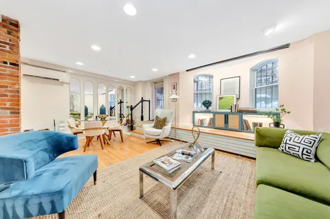 a living room with furniture and a table