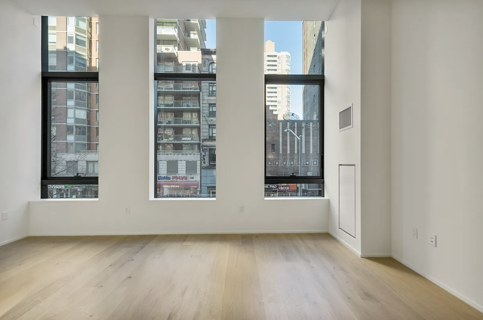 121 East 22nd Street, Unit N203 Manhattan, NY 10010 - Photo 9 of 10 an empty room with windows
