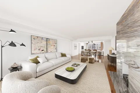 a living room with furniture and a rug