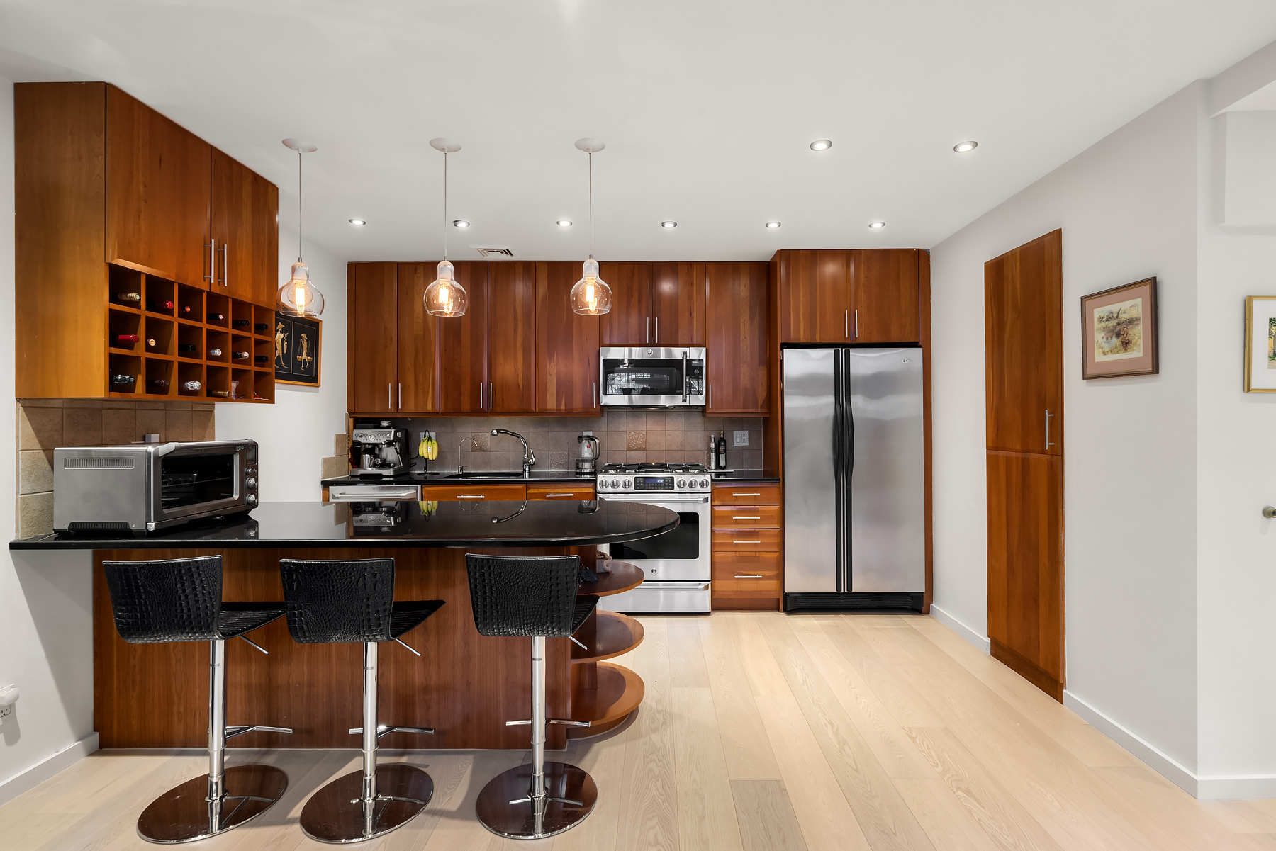 248 East 31st Street, Unit 1D Manhattan, NY 10016 - Photo 9 of 13 a kitchen with stainless steel appliances granite countertop a refrigerator a sink a stove and cabinets