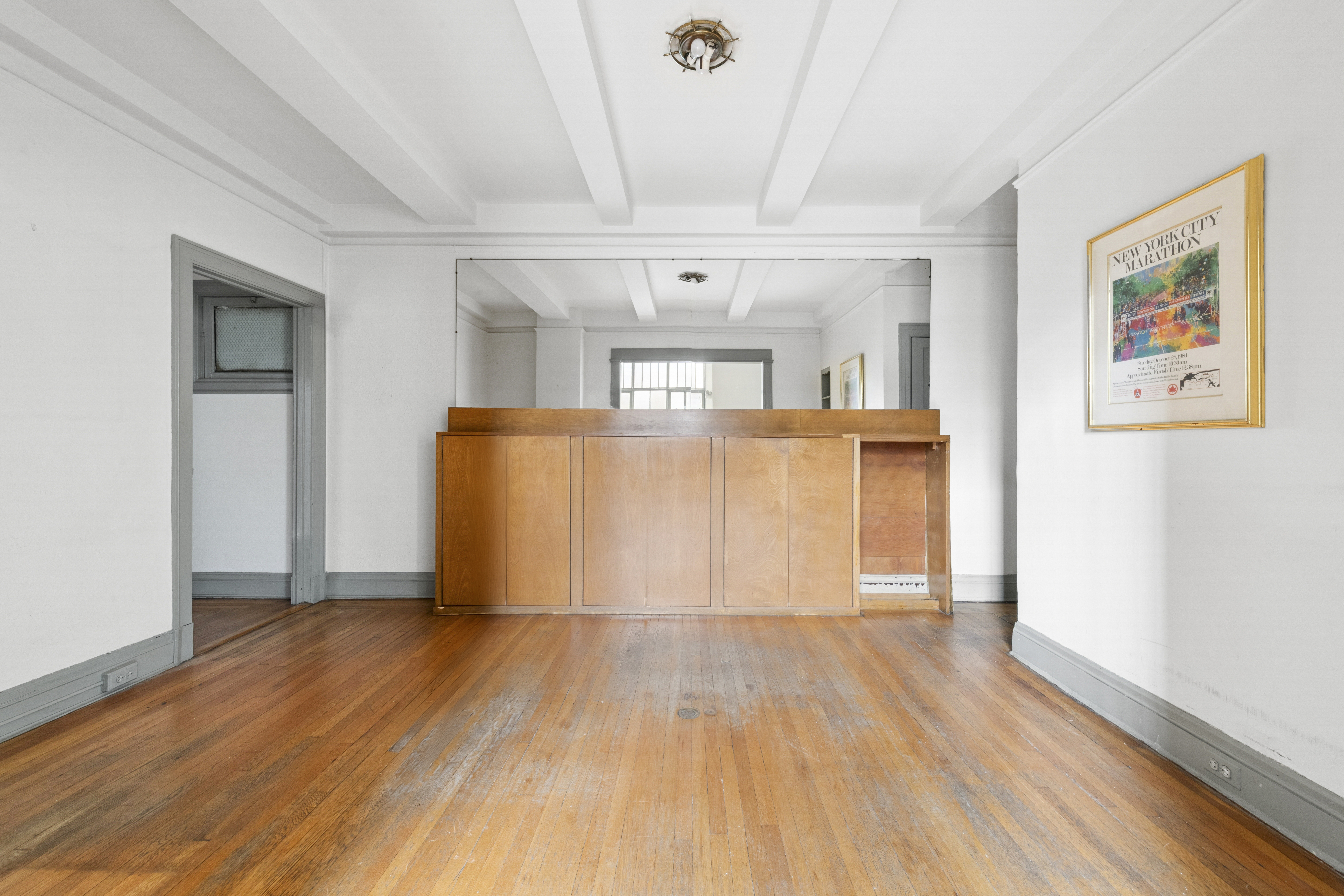 1 West 67th Street, Unit 303-304 Manhattan, NY 10023 - Photo 6 of 18 a view of a big room with wooden floor and windows