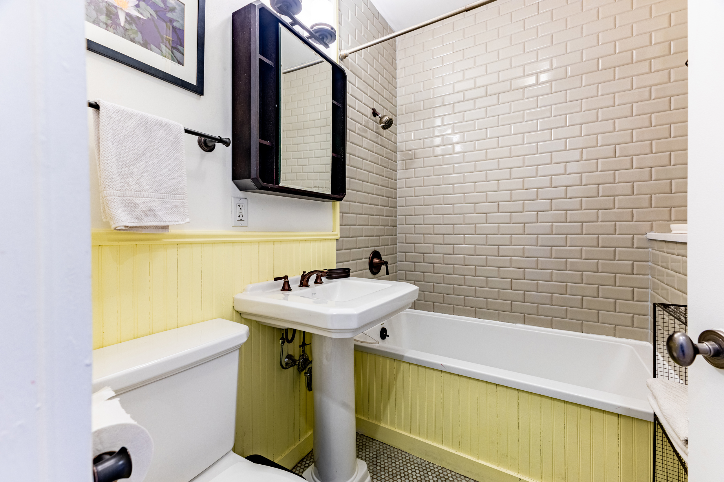 940 Fulton Street, Unit 3B Brooklyn, NY 11238 - Photo 8 of 18 a bathroom with a sink a toilet and shower