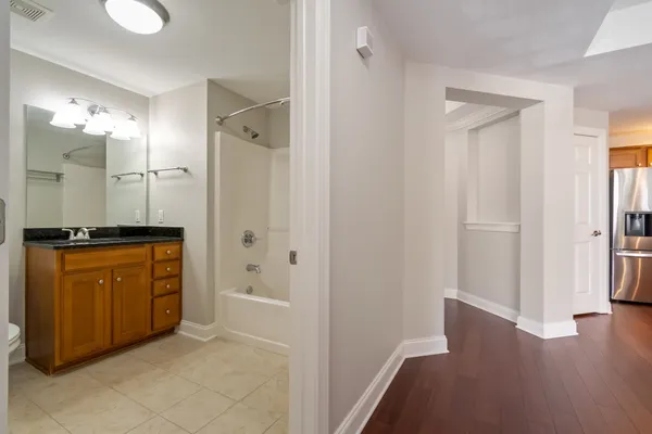 a bathroom with a shower and a sink