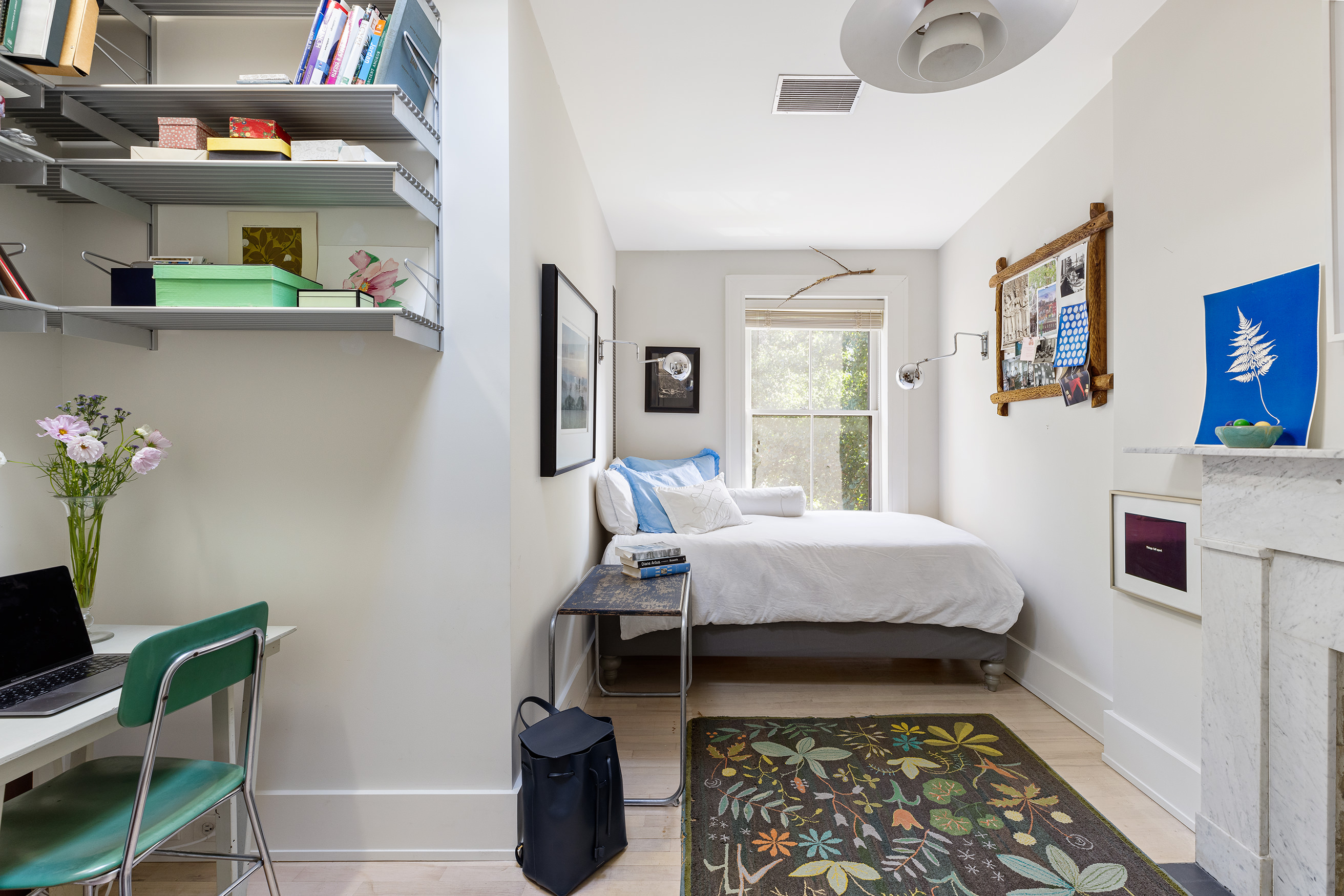 25 Perry Street Manhattan, NY 10014 - Photo 25 of 32 a bed room with furniture and a window