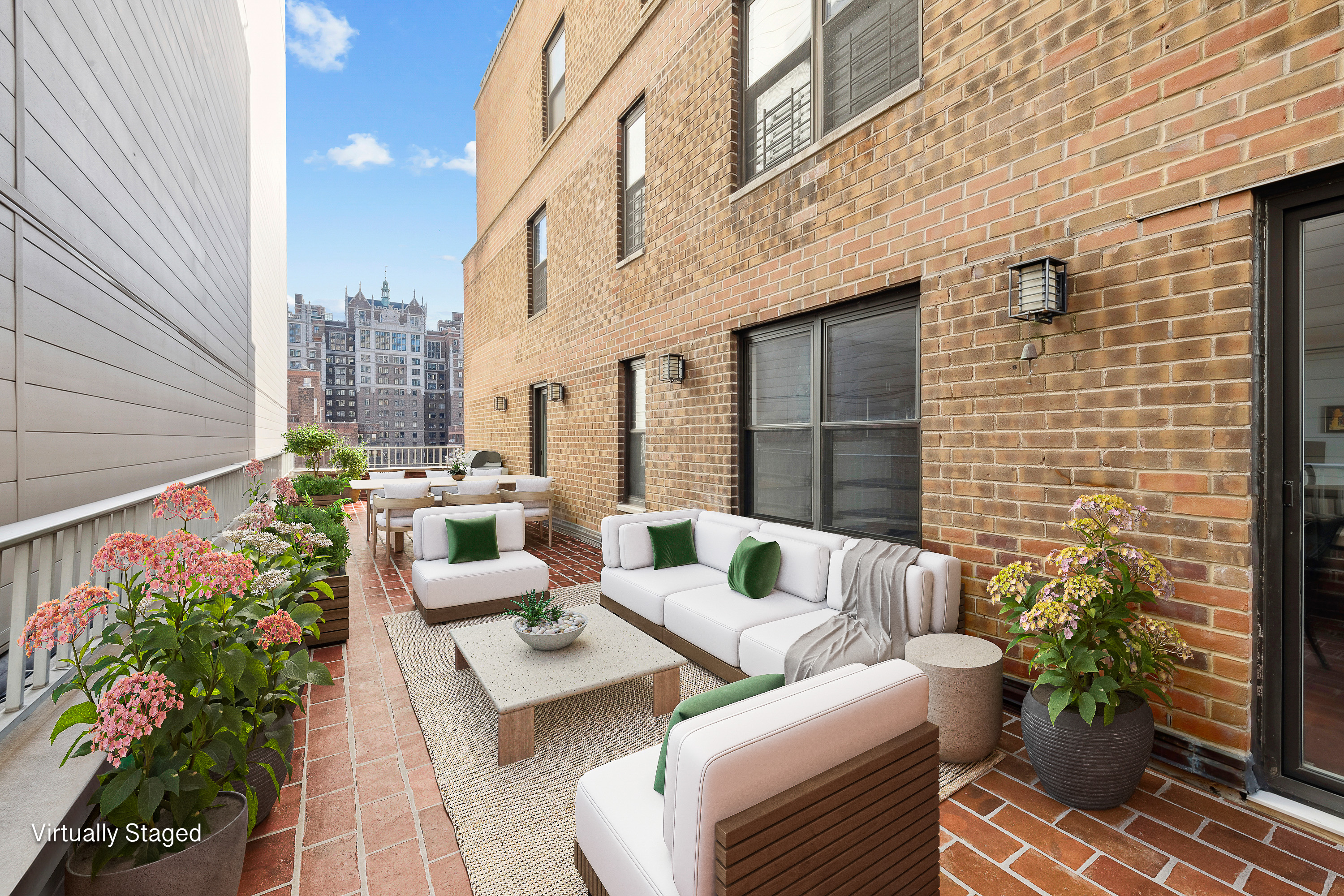 305 East 40th Street, Unit 19CD Manhattan, NY 10016 - Photo 5 of 16 a view of a patio with couches table and chairs and potted plants