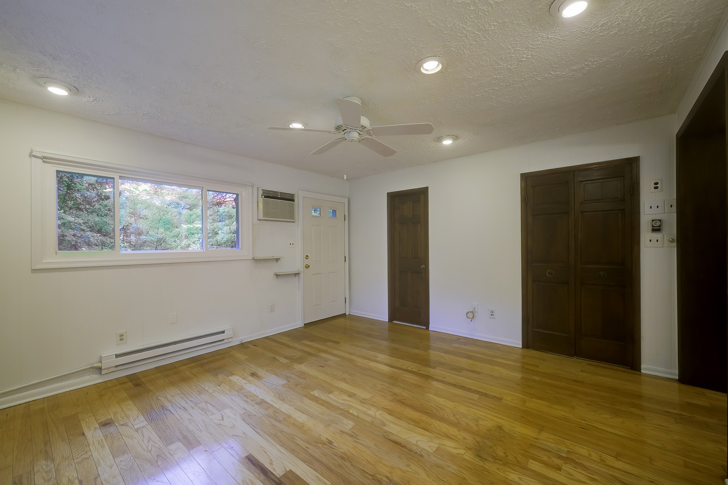 45 D Ridge Road Greenbelt, MD 20770 - Photo 22 of 35 a view of empty room with wooden floor and fan