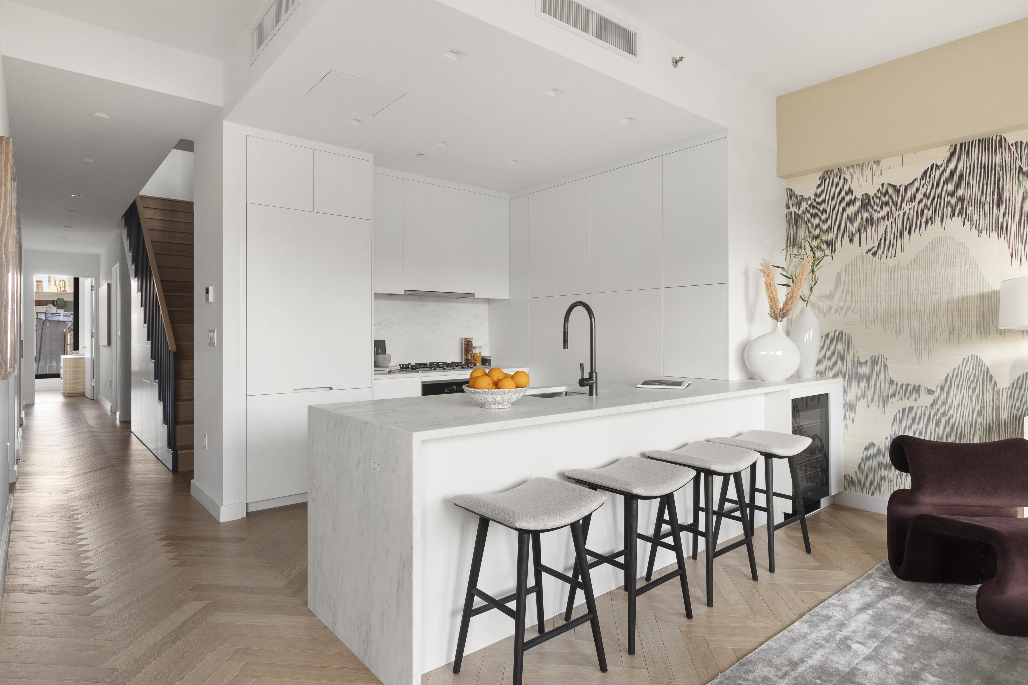 378 Broome Street, Unit PH Manhattan, NY 10013 - Photo 13 of 25 a kitchen with stainless steel appliances a table and chairs in it