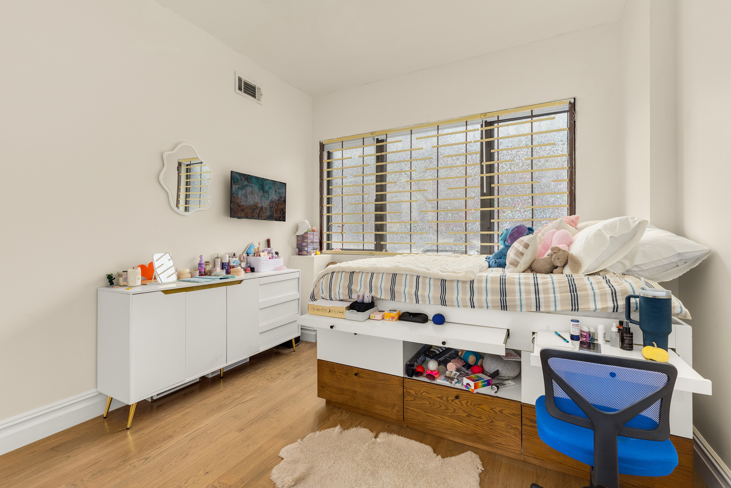 729 Decatur Street, Unit 1 Brooklyn, NY 11233 - Photo 5 of 7 a living room with furniture and flat screen tv