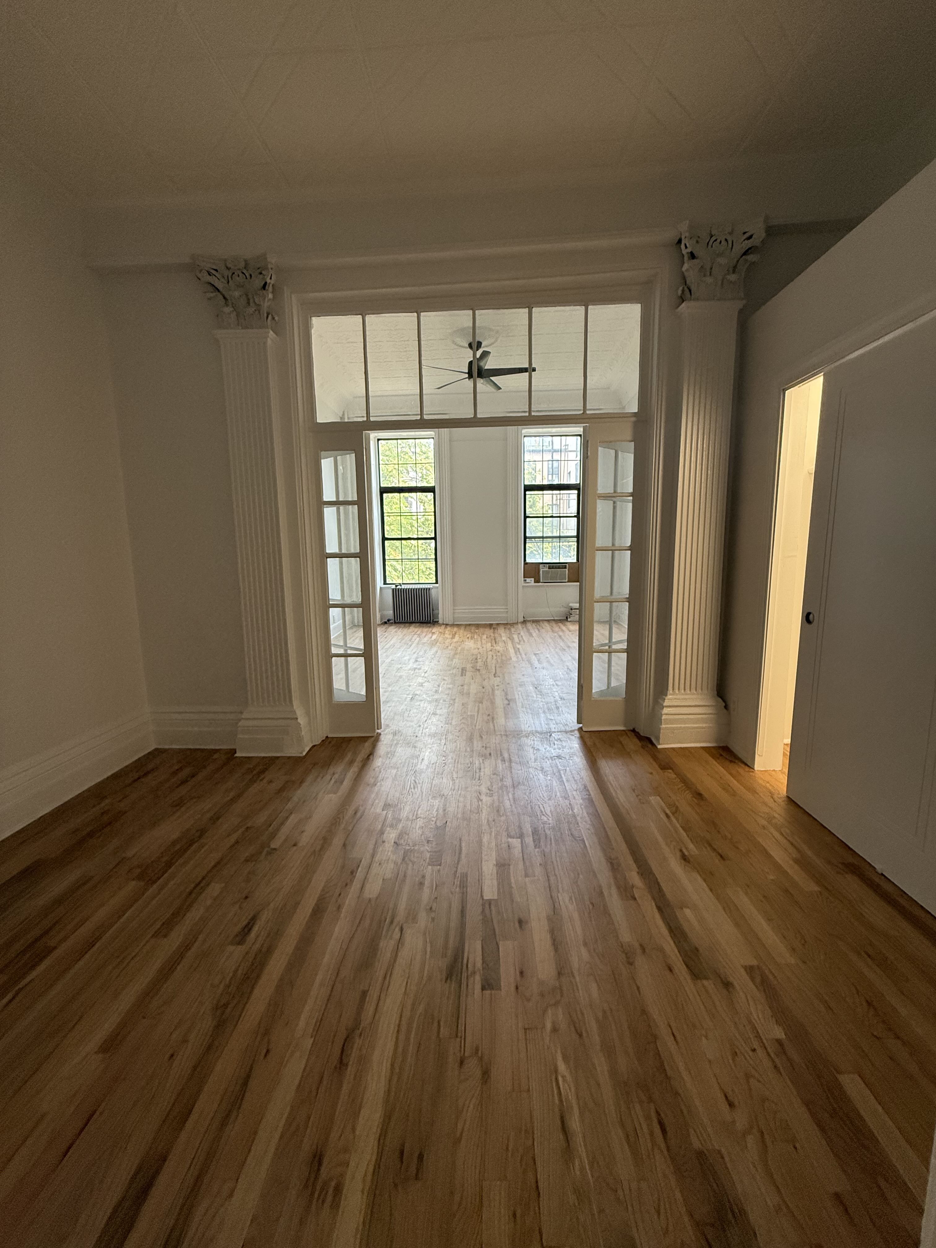 141 Summit Street, Unit 2 Brooklyn, NY 11231 - Photo 10 of 12 wooden floor in an empty room with a window