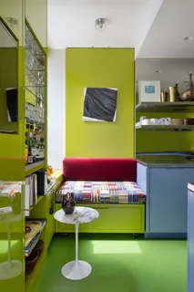 a room with a table chair and a fireplace