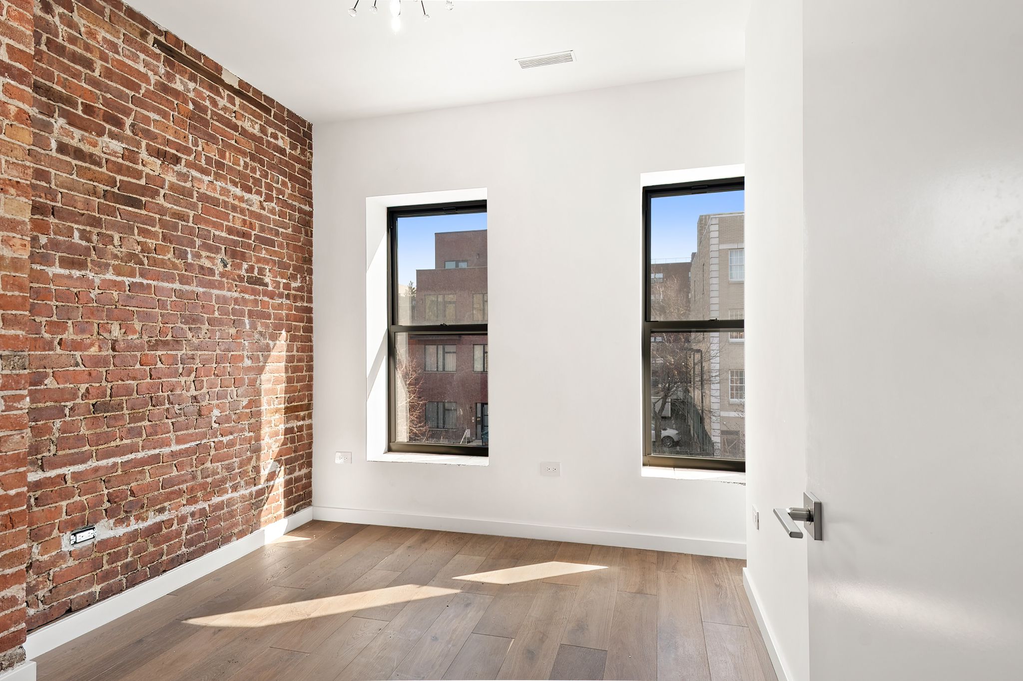 181 Kosciuszko Street Brooklyn, NY 11216 - Photo 9 of 20 a view of an empty room with a window