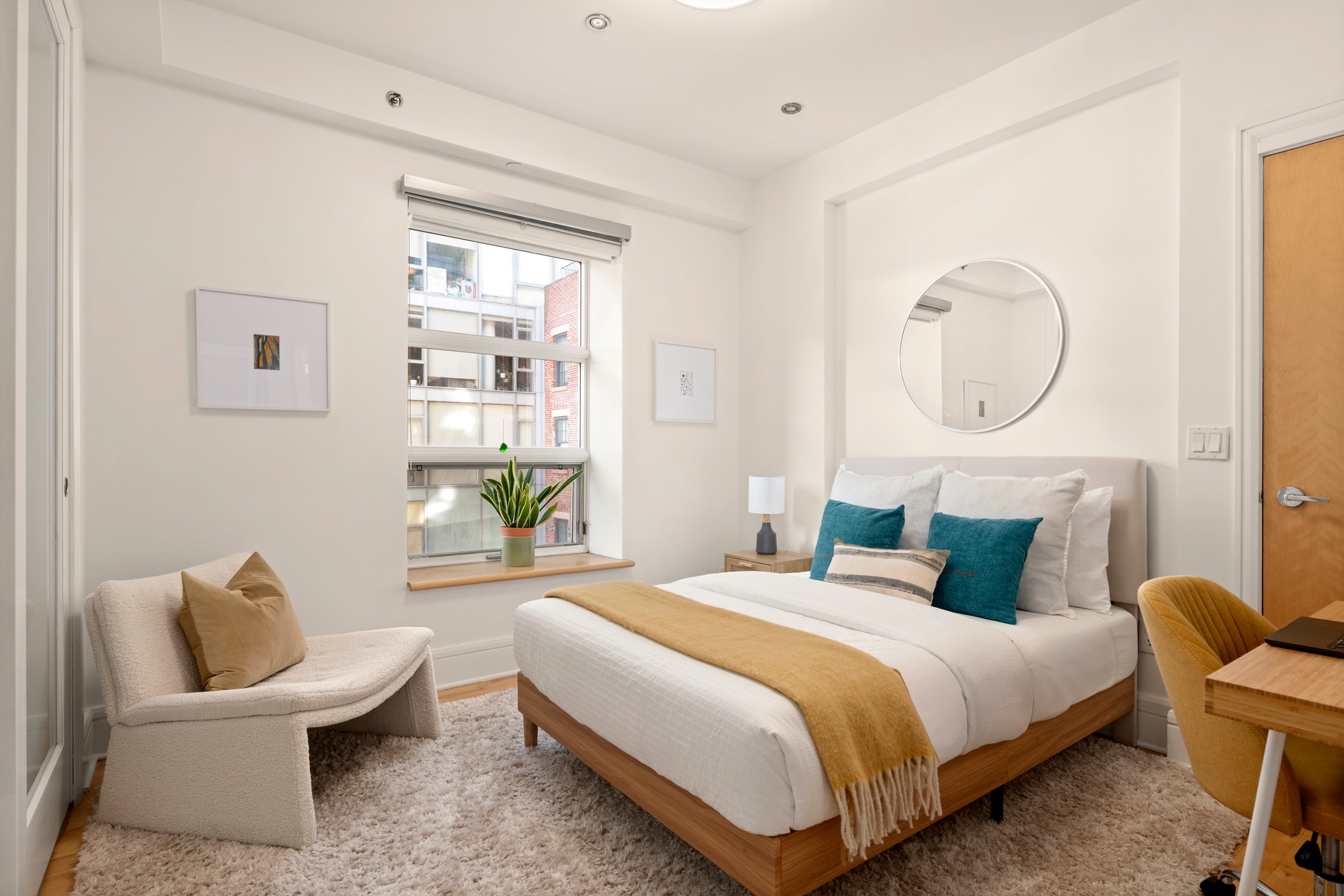 57 Front Street, Unit 303 Brooklyn, NY 11201 - Photo 9 of 15 a bedroom with a bed and a chair